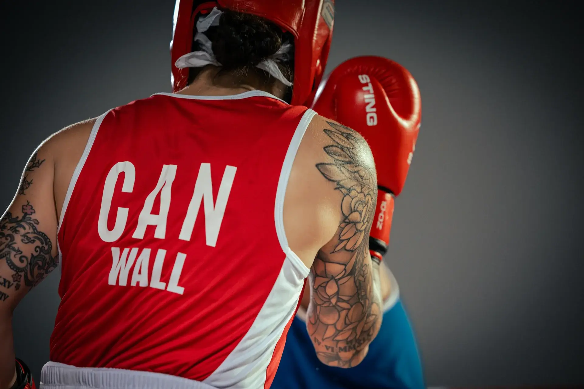 Boxer wearing a red Canada singlet with Wall on the back